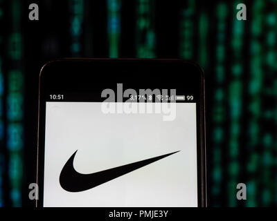 Nike Footwear manufacturing company logo seen displayed on a smart phone. Inc. is an American