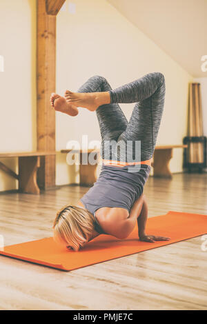 Beautiful woman doing yoga in the nature,Vrschikasana / Scorpion pose Stock  Photo - Alamy