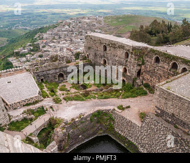 Krak des Chevaliers, formerly Crac de l'Ospital is a Crusader castle in Syria and one of the most important medieval castles in the world. Stock Photo