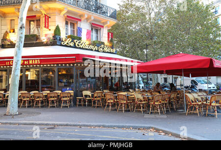 Cafe Le Champ de Mars is traditonal French cafe located near the Eiffel tower in Paris, France. Stock Photo