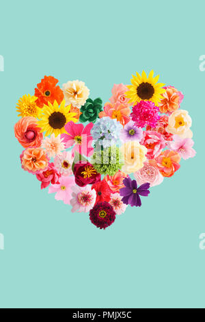 Heart symbol made of crepe paper flowers isolated on turquoise background Stock Photo