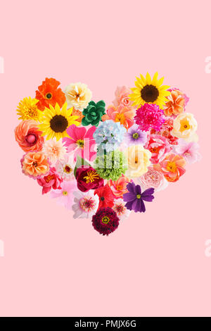 Heart symbol made of crepe paper flowers isolated on pink background Stock Photo