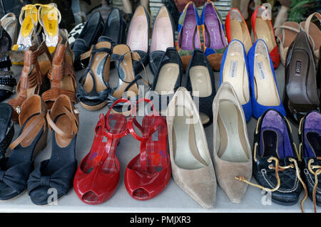 Used women's shoes for sale in a thrift shop on Main Street in Vancouver, BC, Canada Stock Photo