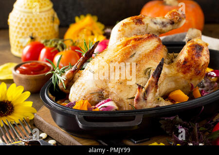 Thanksgiving Day food concept. Homemade Roasted Turkey on dark rustic background. Stock Photo