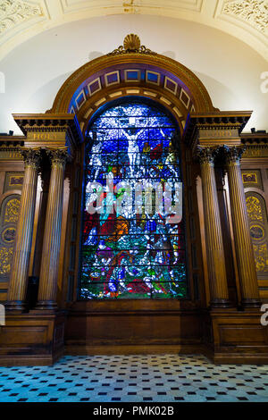 Enamelled glass window depicting the crucifixion of Jesus Christ, Sermon on the Mount, St Anne's Limehouse, London, UK Stock Photo