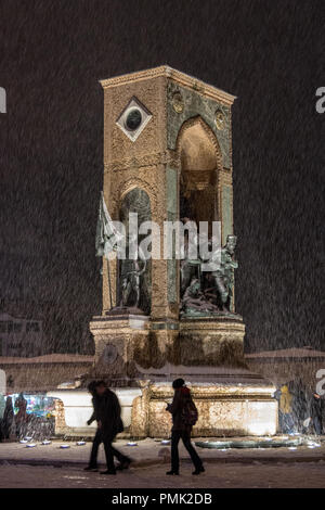 ISTANBUL, TURKEY - DECEMBER 30, 2015: Republic Monument, or Monumento Alla Republica, or Cumhuriyet Aniti, during a snow storm on Taksim Square, an it Stock Photo