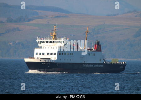 MV Argyle, a passenger ferry operated by Caledonian MacBrayne on the Firth of Clyde, passing the coastal town of Gourock in Inverclyde.. Stock Photo