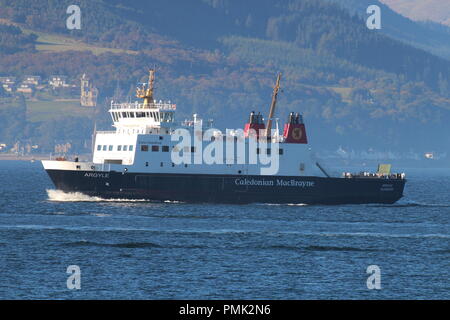 MV Argyle, a passenger ferry operated by Caledonian MacBrayne on the Firth of Clyde, passing the coastal town of Gourock in Inverclyde.. Stock Photo