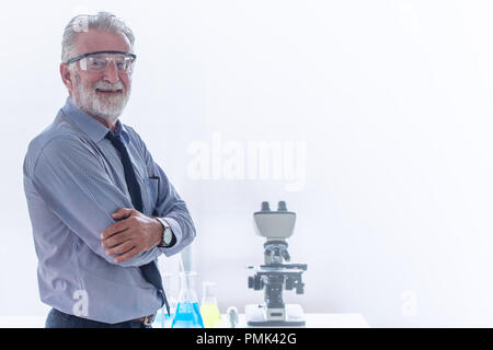 Chemistry professor scientist in science chemical standing happy smile with copy space. Stock Photo