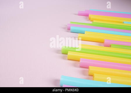 Plastic Drinking Straws on Pink Background Stock Photo