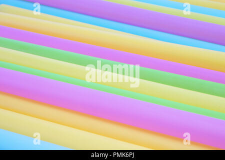 Multiple brightly coloured plastic straws - macro Stock Photo