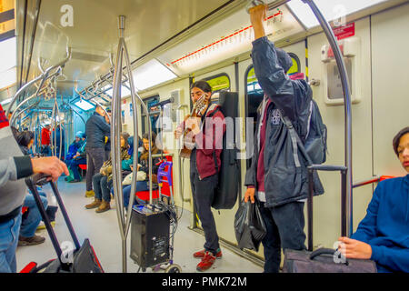 SANTIAGO, CHILE - SEPTEMBER 14, 2018: Indoor view of unidentified people inside of electric train on central railway station in Santiago, Chile Stock Photo