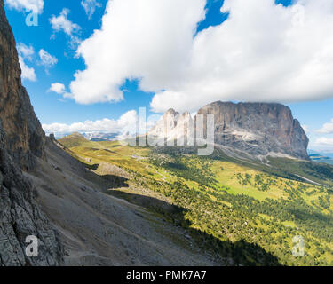 great Dolomite autumn landscape in Alta Badia with the Passo Sella and a view of the majestic Langkofel peak in the Val Gardena in northern Italy Stock Photo