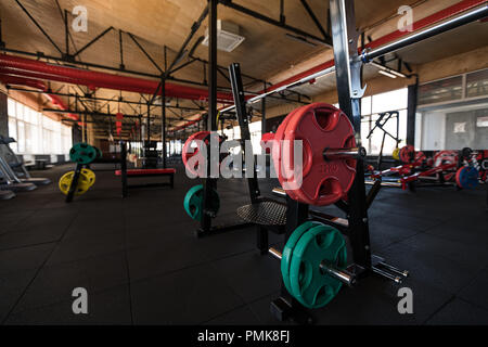 sport, bodybuilding, lifestyle and people concept - barbell in gym Stock Photo