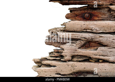 Driftwood with rusted bolts set against a concrete stone wall, vintage grunge isolated on white horizontal background Stock Photo