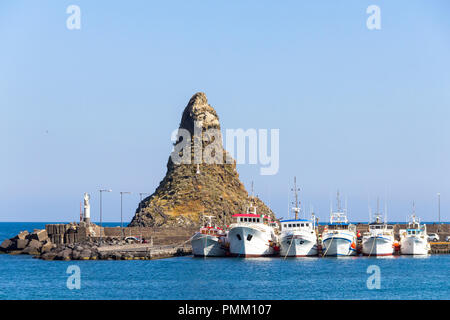 Boats in the marina of Aci Trezza and Cyclopean Isles, Catania, Sicily, Italy Stock Photo