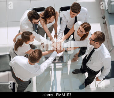 top view.employees of the company making a tower out of hands Stock Photo