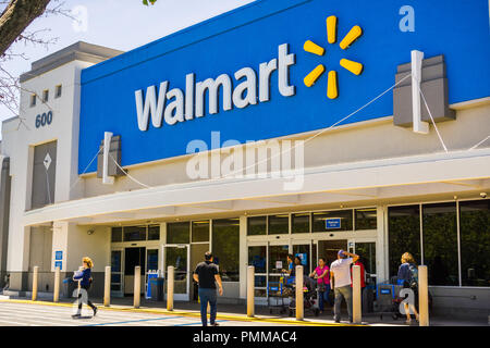 May 11, 2018 Mountain View / CA/ USA - People going in and coming out of a Walmart store on a sunny day, south San Francisco bay area Stock Photo