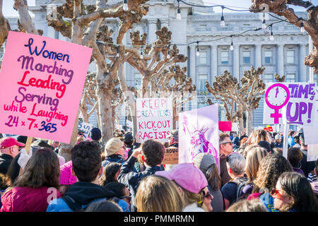 January 20, 2018 San Francisco / CA / USA - Various raised signs at the Women's March rally taking place in the Civil Center Plaza