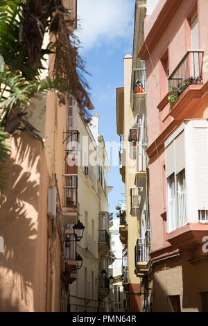 A narrow street in the old quarter of the city of Cadiz in Andalusia, Spain Stock Photo