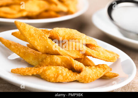 Fresh homemade crispy deep-fried angel wing or bowtie cookies, traditional biscuits in many European countries (Selective Focus) Stock Photo