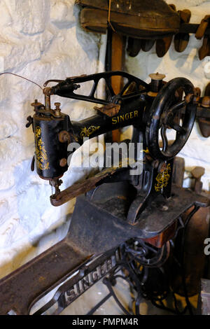 Singer sewing machine in a Shoemakers work shop at Ryedale Folk Museum, Hutton le Hole, Yorkshire UK Stock Photo