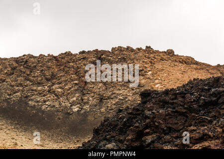 Layers of rocky lava flow from a volcanic eruption in lava fields on Lanzarote Stock Photo