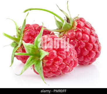 Red colored raspberries with two leaves isolated on white background Stock Photo