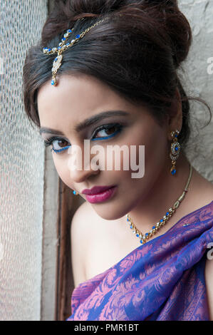 Beautgiful Indian woman by the window Stock Photo