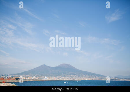 A view of Mount Vesuvius a volcano near Naples, from the shore of Naples with the sea in the foreground, on a summer's day Stock Photo