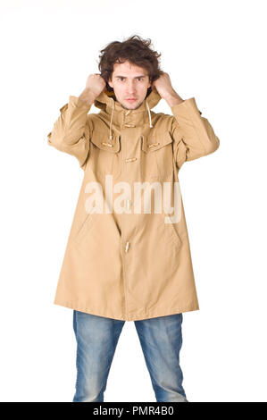Daily man wearing in raincoat pointing his hood Stock Photo