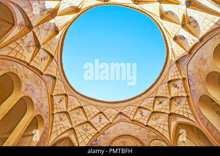 KASHAN, IRAN - OCTOBER 22, 2017: The scenic dome with muqarnas decors, painted arabesques and the light hole in room of Tabatabaei House, on October 2 Stock Photo