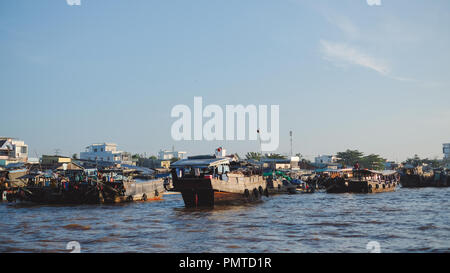 Crowded atmosphere on Cai Rang floating market, group people with trade activity on farmer market of Mekong Delta river Stock Photo