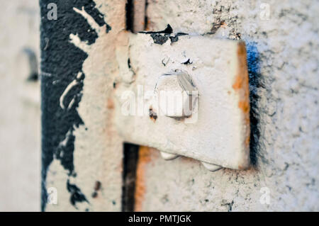 Metal buckle on the dirty wall, old and dirty Stock Photo