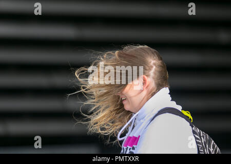 Dundee, Scotland. UK Weather 19/09/2018.  Storm Force Winds hit northern Scotland. Visitors to the city have to endure severe winds with pedestrians being blown over on the seafront promenade. Storm Ali, blow, tempest, flyaway hair, tangled tresses, bad hair day. Credit; MediaWorldImages/AlamyLiveNews. Stock Photo