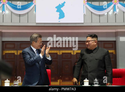 Sep 20, 2018 - Pyeongyang, North Korea - South Korean President Moon Jae-in watched a controversial mass gymnastics performance in Pyongyang late Wednesday on the second day of his trip, alongside North Korean leader Kim Jong-un. As the two leaders entered the May Day Stadium, the venue of the performance, together at about 9 p.m, some 150,000 Pyongyang citizens cheered and gave them an emotional standing ovation. The cheers became louder when Moon waved his hands toward the crowd. (Credit Image: © Pool/Pyongyang Press Corps via ZUMA Wire) Stock Photo