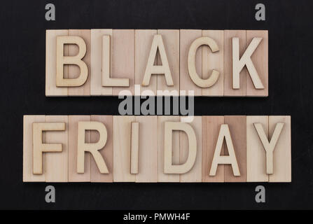 black Friday - text in wooden letters on blackBoard. Copy space. Stock Photo
