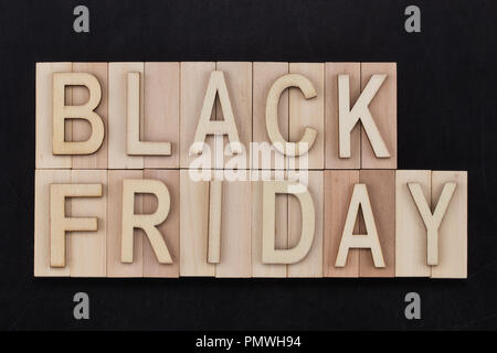 black Friday - text in wooden letters on blackBoard. Copy space. Stock Photo