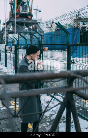 Shipyard worker smoking Stock Photo
