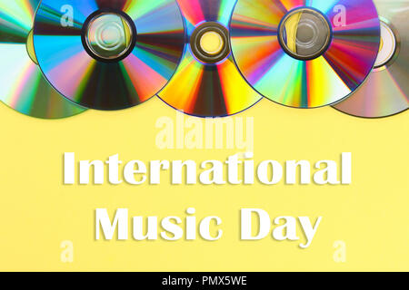 World, international music day. Piles of old and dirty CDs,DVD on pastel background. Used and dusty disk Stock Photo