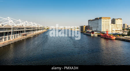 London, England, UK - September 2, 2018: The ExCeL exhibition centre faces the derelict Millennium Mills warehouse on Royal Victoria Dock in London's  Stock Photo