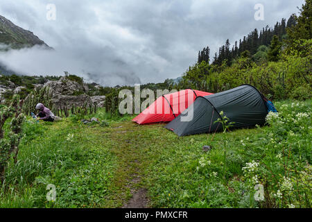 Ala-Kol Trek that departs in the Karabel-Tor mountains that erupt to the southeast beyond Karakol in Kyrgyzstan’s far east. Stock Photo