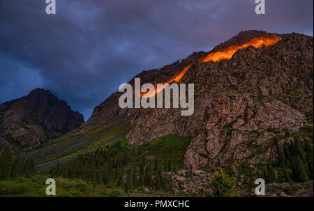 Ala-Kol Trek that departs in the Karabel-Tor mountains that erupt to the southeast beyond Karakol in Kyrgyzstan’s far east. Stock Photo