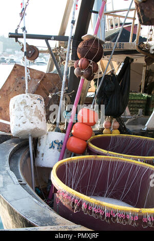 Long line fishing gear, containers with hooks inside a boat