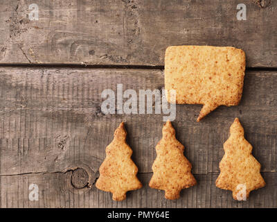 Tasty homemade cookies on a rustic wooden table, Seasonal or food concept background Stock Photo