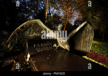 At the municipal cemetery Essen-Bredeney there is a separate area where the graves of the Krupp family are located. The tomb of Friedrich Alfred Krupp, is made of dark granite and is adorned by a huge bronze eagle. Stock Photo