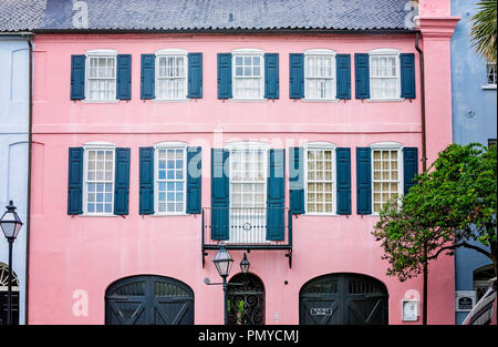 Pink paint lends a tropical air to a historic Rainbow Row home, April 5, 2015, in Charleston, South Carolina. Stock Photo