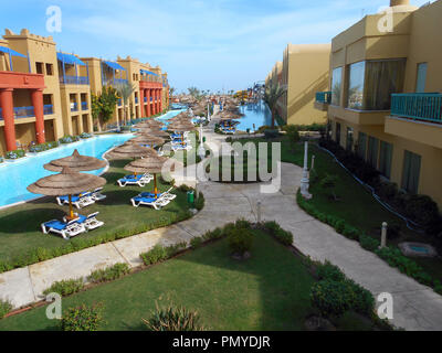 The low level apartments and swimming facilities at one of the many hotels at the Red Sea holiday of Hurghada in Egypt. Stock Photo