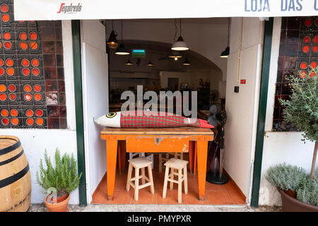 Restaurant with large fabric fish on table Lisbon Stock Photo