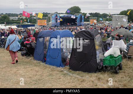 England, Oxfordshire, Three fold out chairs with weather proof plastic covers at Cropredy festival. Stock Photo